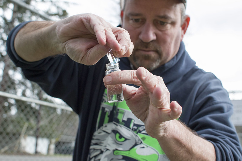 PUD employee performs water quality test