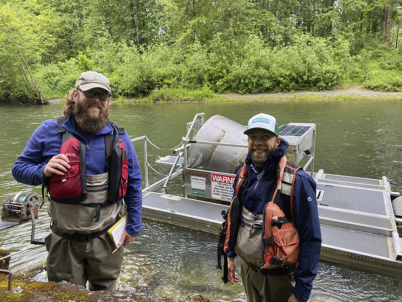 PUD employees near smolt trap on Sultan River