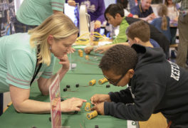 Heather helps student at STEM night