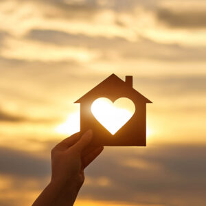 Photo of house will sun shining through heart cut-out