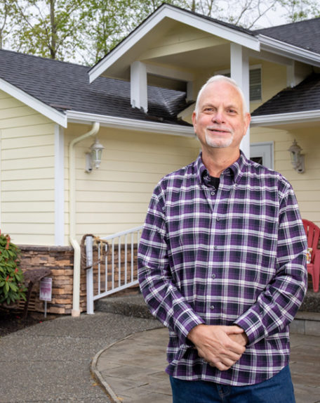 FlexEnergy participant in front of home