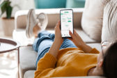Woman using MySnoPUD app on smartphone