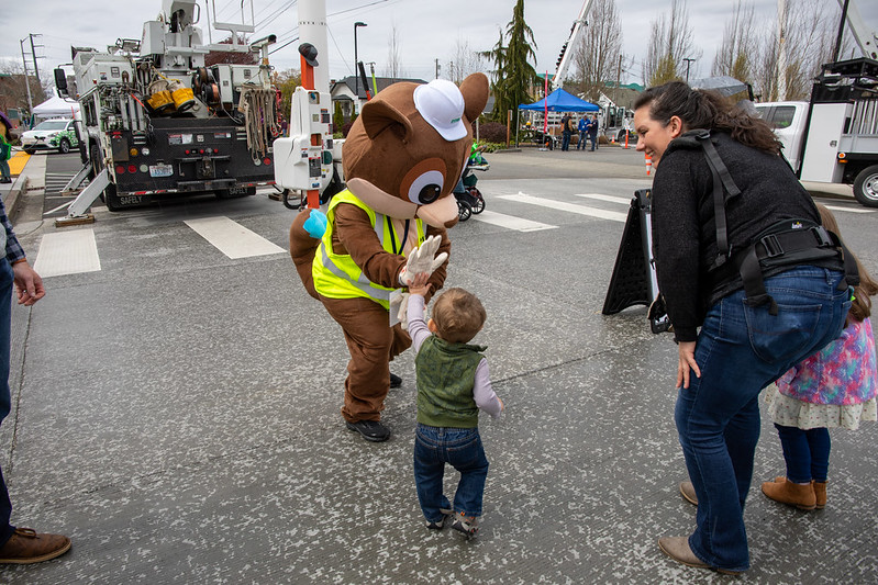 Youngster giving mascot the high 5