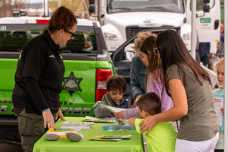 A family visits a safety booth