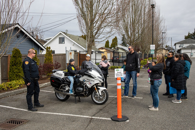 A young man sits on the police motorcycle