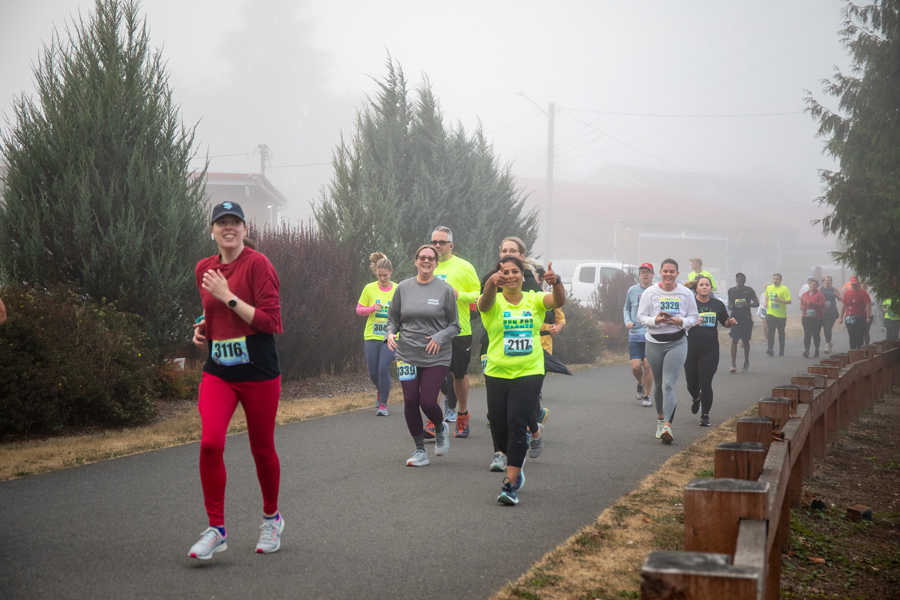 Runner giving thumbs up during race