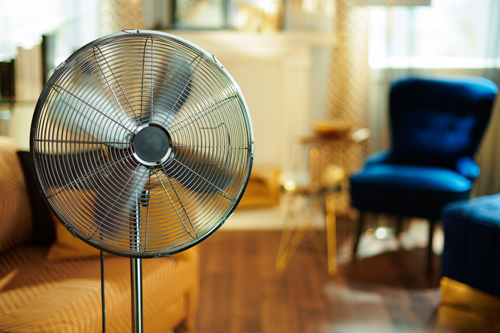Fan cooling off interior of home on hot day