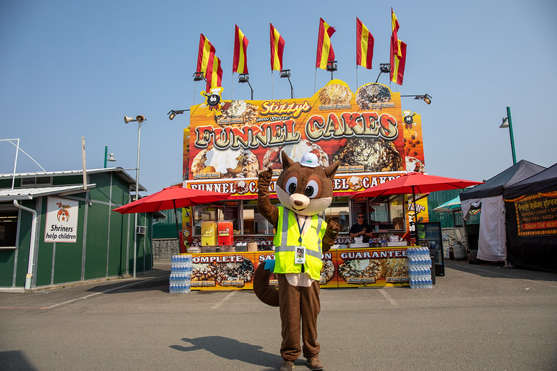 Mascot Squirrel poses with fair games