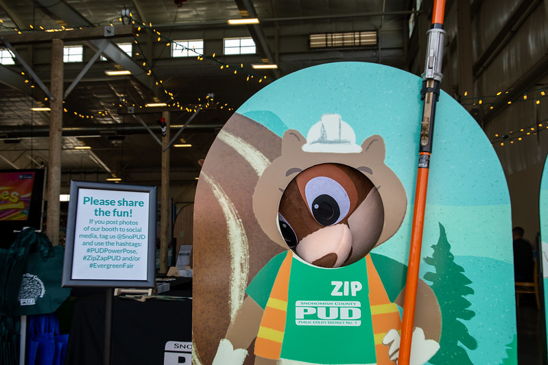 Mascot squirrel peeks through photo display