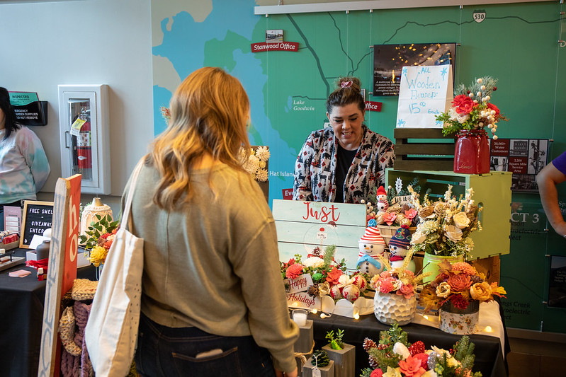 Customers looking at stuffed snowmen and other winter delights