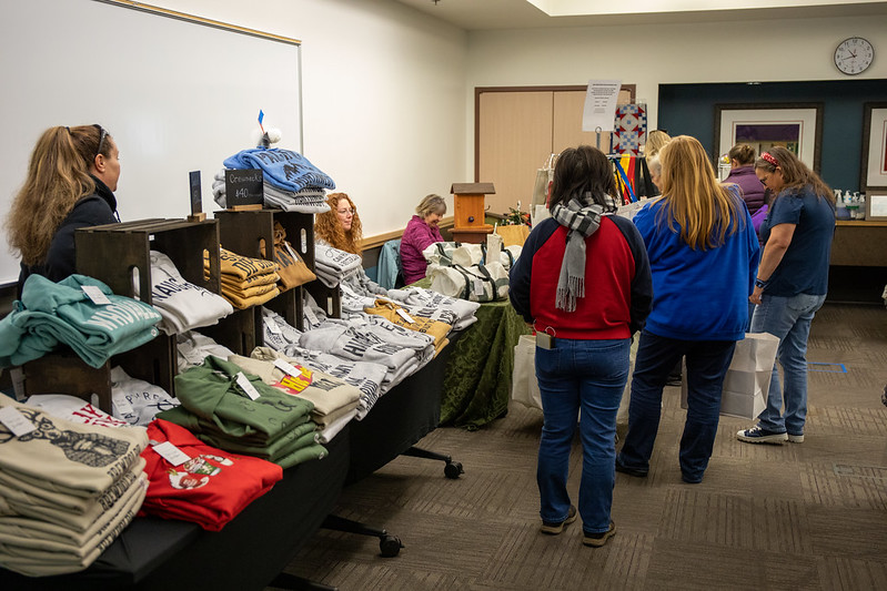 Customers browsing winter/holiday themed clothing