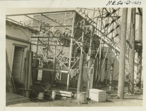 A framework of metal, cables in electrical equipment making up a 1930s substation in Monroe, WA