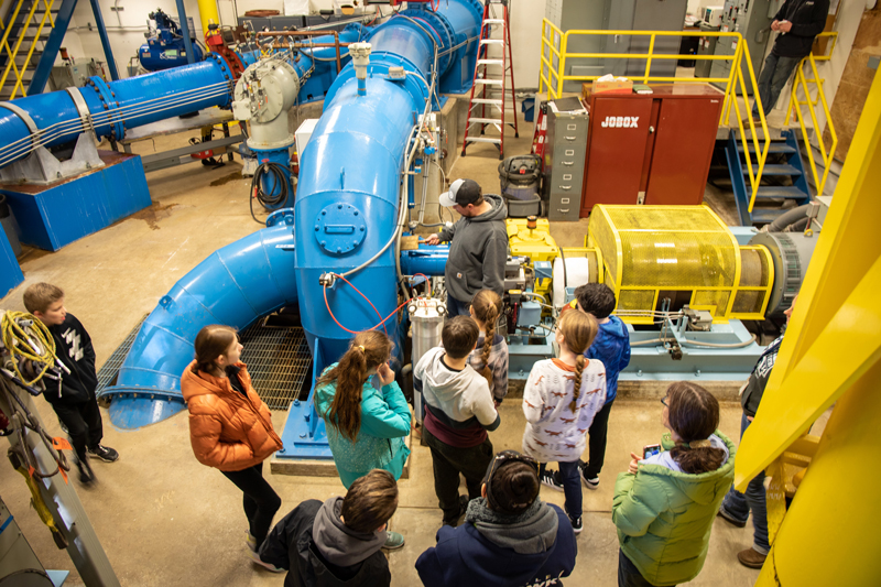 Students survey the inner workings of the Woods Creek Hydro Project