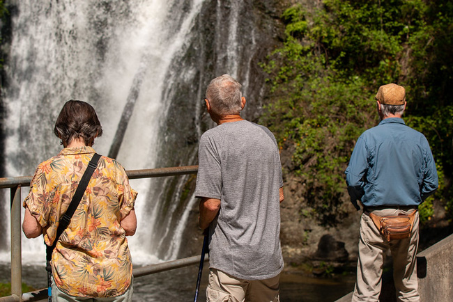 Guests admire the Woods Creek Waterfall