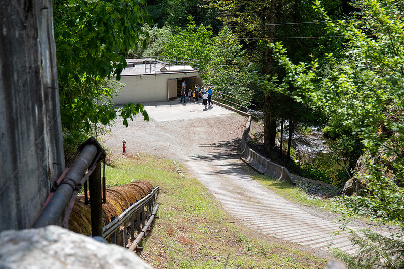 Guests visiting the Woods Creek Hydro Project powerhouse