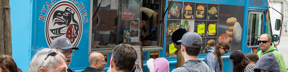 Folks lining up to enjoy a tasty treat from Ryan's Rez-ipes gourmet food truck