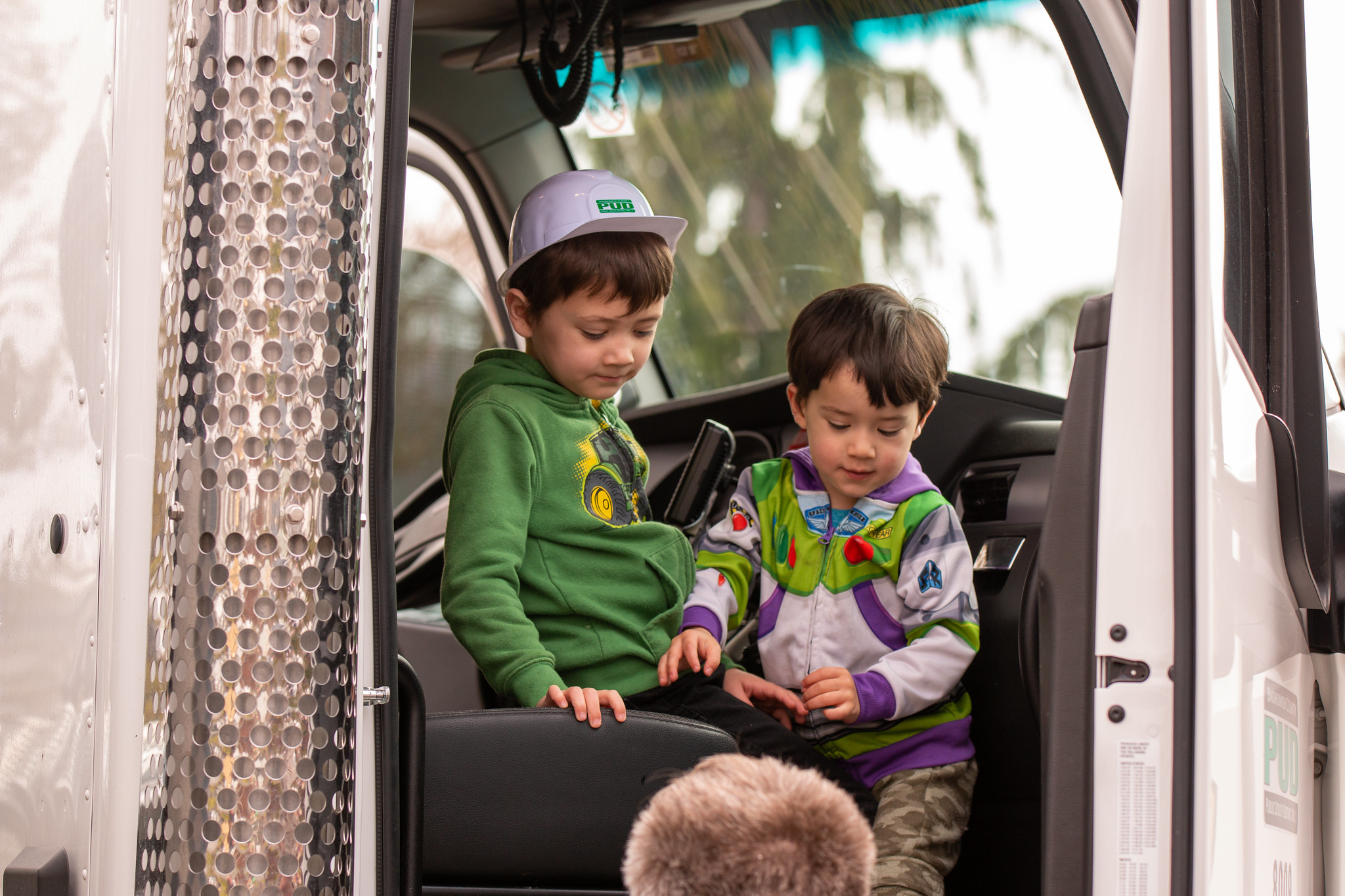 Youngsters having fun in large truck cab