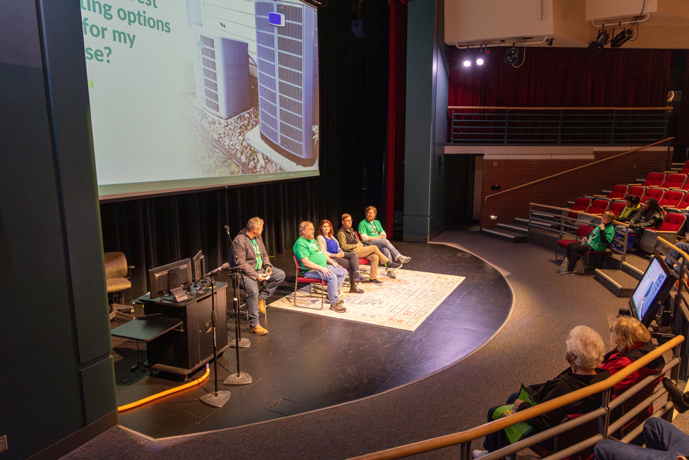 PUD staff on stage in the Electric Building Auditorium