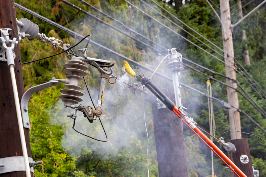 A pickle being roasted by electrical energy during a safety demonstration by professional lineman