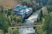 Powerhouse at Jackson Hydro Project with Sultan River shining in the foreground